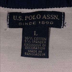 U.S POLO ASSN. polo shirt, with three on shoulder.
